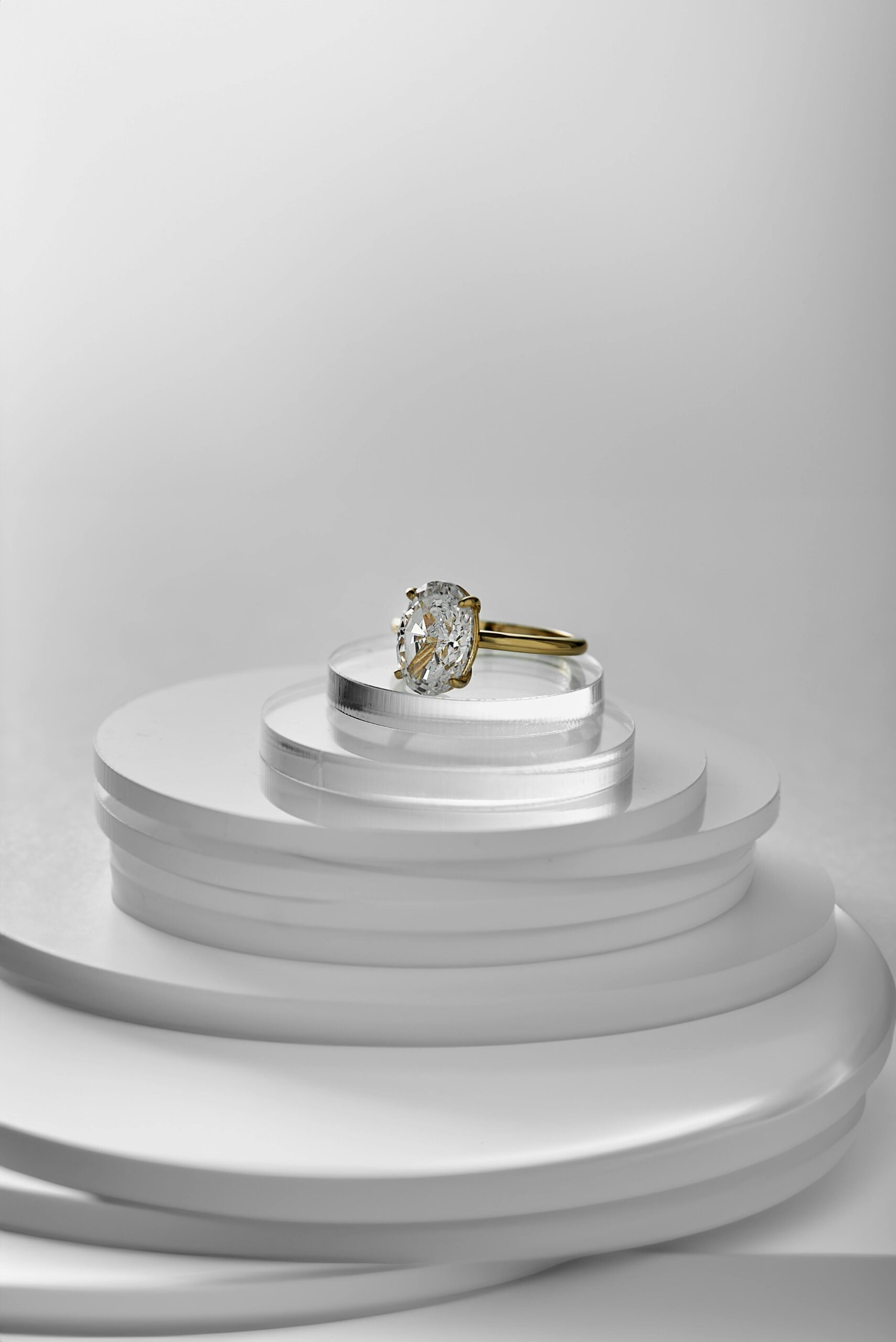 Minimalist display of a luxury gold and diamond ring highlighting sophistication.