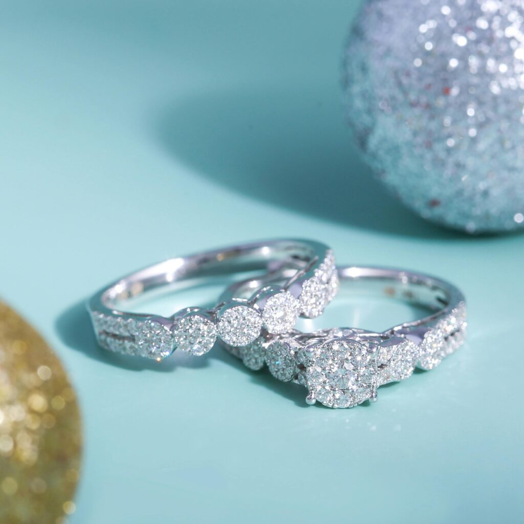 Close-up of luxurious diamond rings against a sparkling background, symbolizing elegance and affluence.
