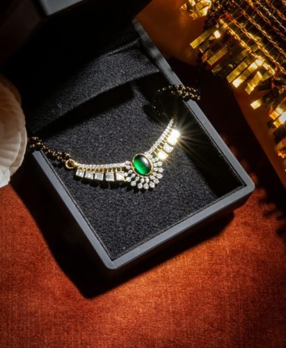 pexels-photo-12507511-12507511 A luxurious emerald necklace with diamonds displayed in an open black jewelry box, ready for gifting.
